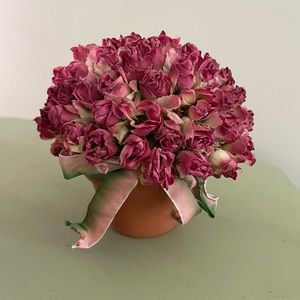 Silk roses in terracotta flower pot